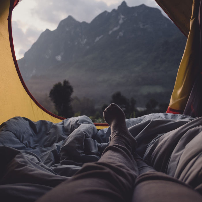 Person Inside Camping Tent in The Mountains