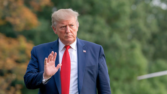 Donald Trump outside and waving with his right hand